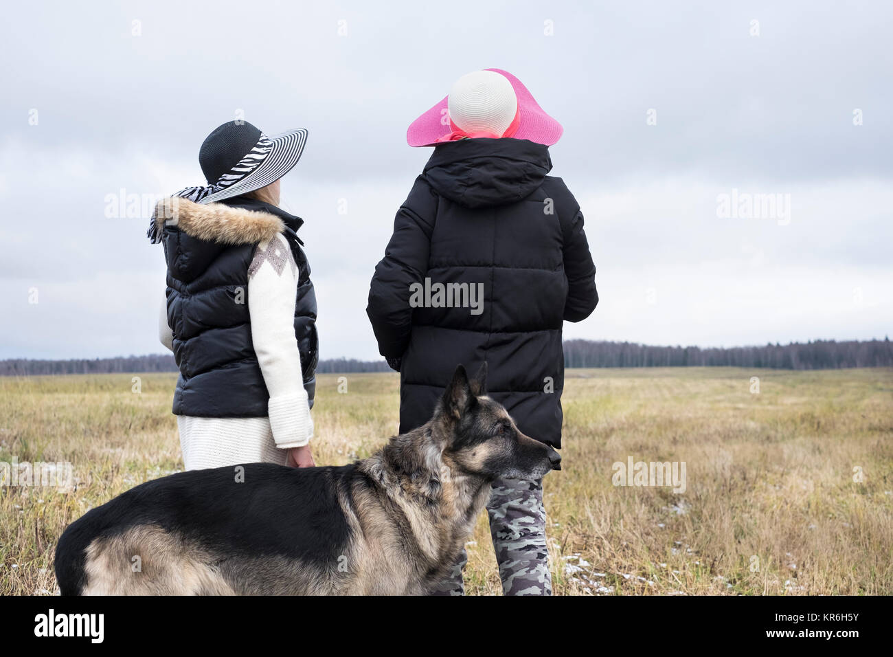 Two women walking a dog hi-res stock photography and images - Alamy