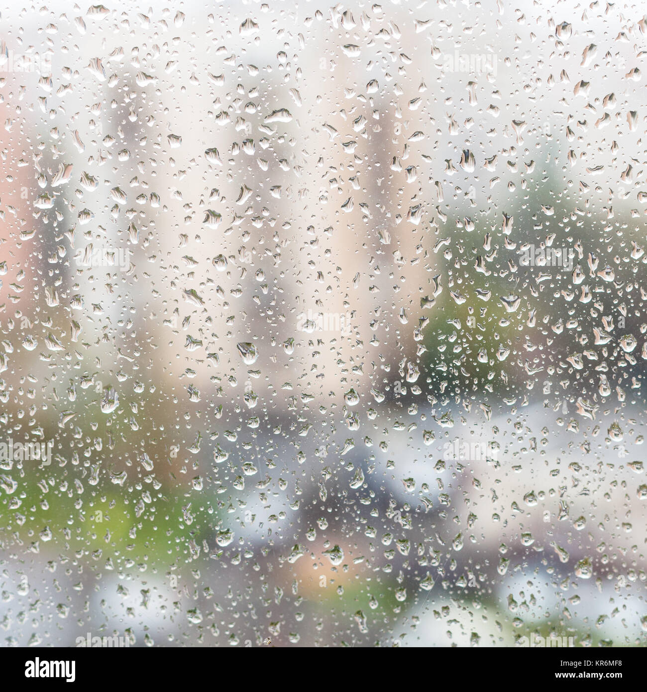 rain drops on window glass of apartment house Stock Photo Alamy