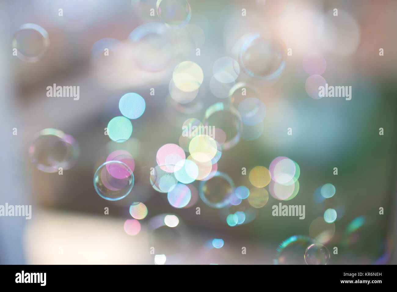 Photo of soap bubbles into the sunlight with beautiful bokeh, pastel colors. Stock Photo