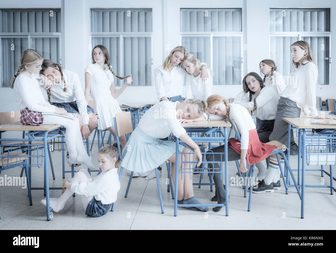 Bored students waiting for the class to finish. Stock Photo