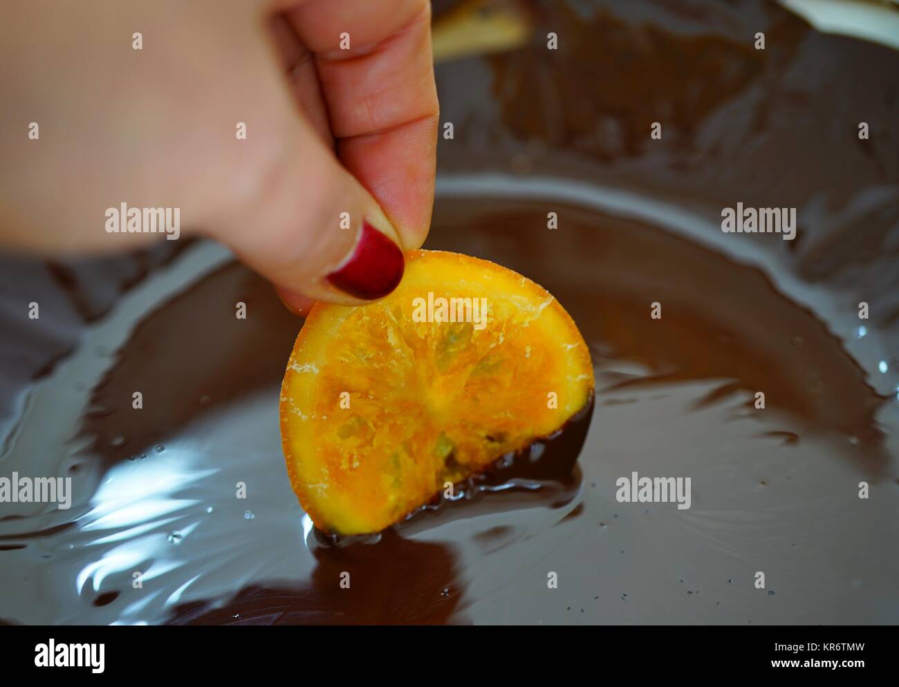 Making candied orange slices dipped in dark chocolate Stock Photo Alamy