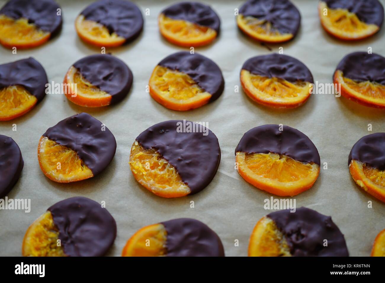 Making candied orange slices dipped in dark chocolate Stock Photo Alamy