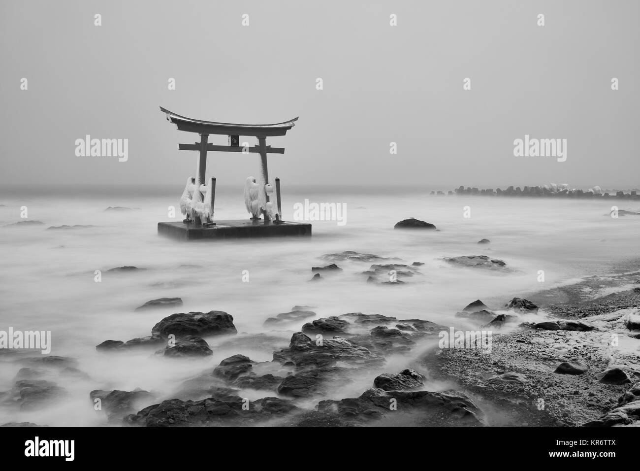 Traditional wooden torii gate in the ocean, Shosanbetsu Konpira Shrine. Stock Photo