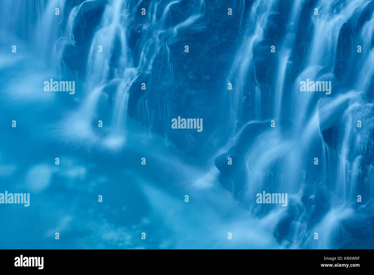 Close up of cobalt blue water cascading at White Beard Waterfall, Shirogane, Biei. Stock Photo