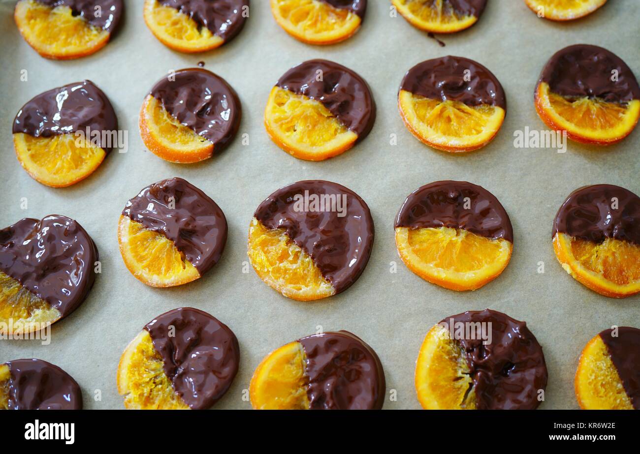 Making candied orange slices dipped in dark chocolate Stock Photo Alamy