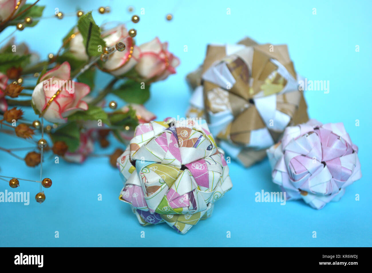 Modular origami, sonobe ball, on blue background Stock Photo