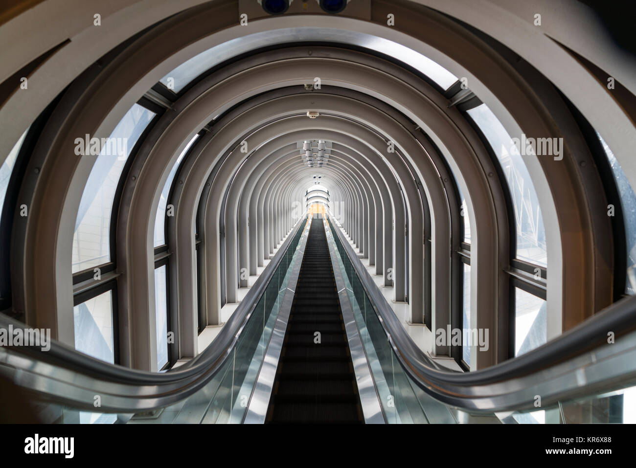 Interior view of contemporary building with escalator running across