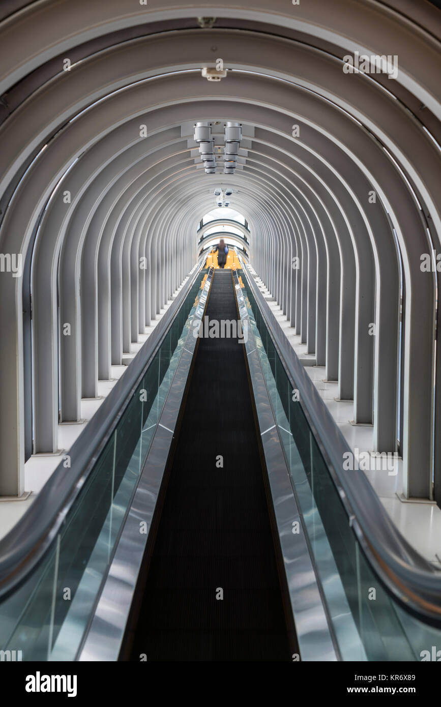 Interior view of contemporary building with escalator running across