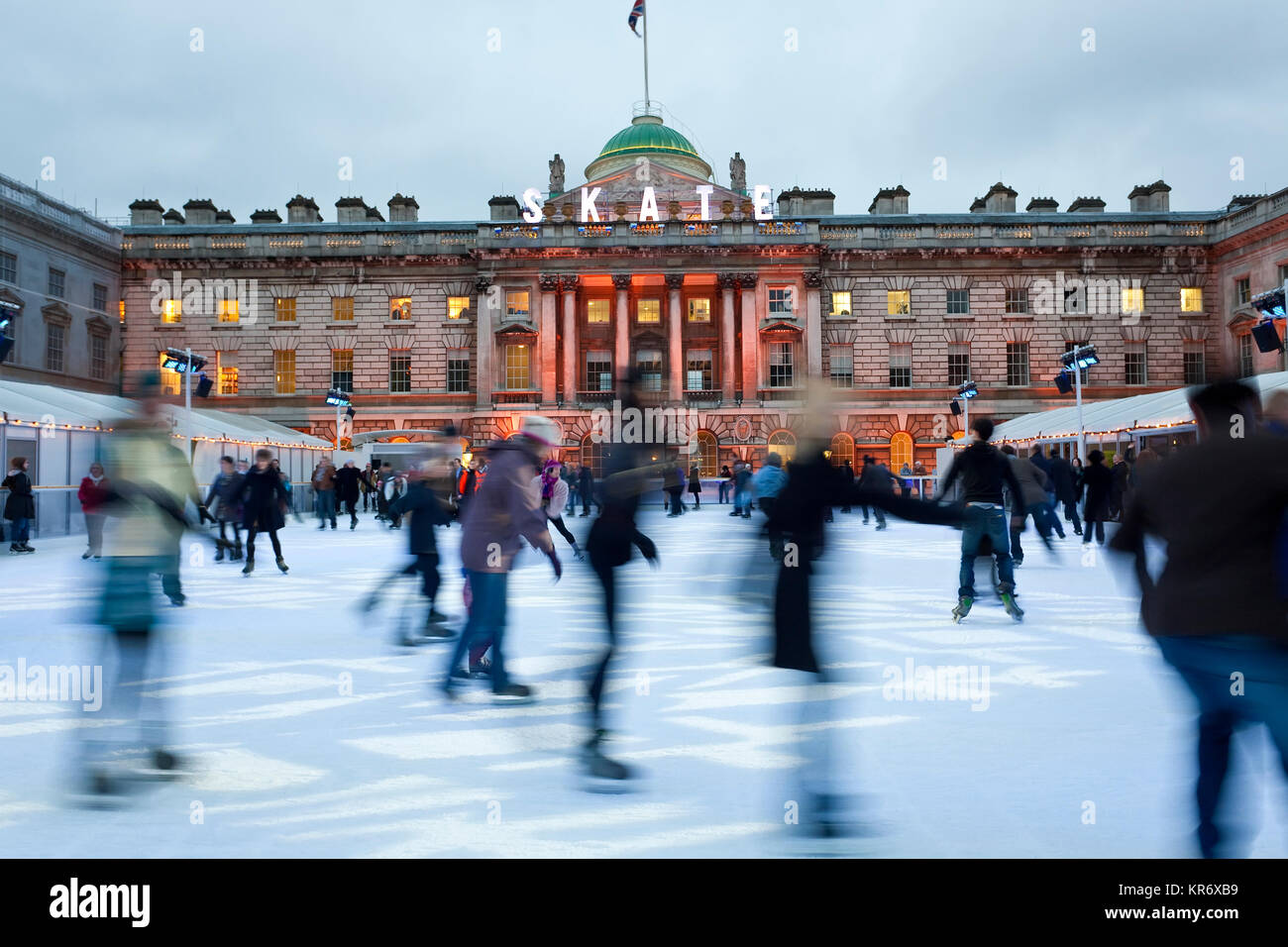 Ice skaters on the ice rink in the courtyard of Somerset House, London, UK. Stock Photo