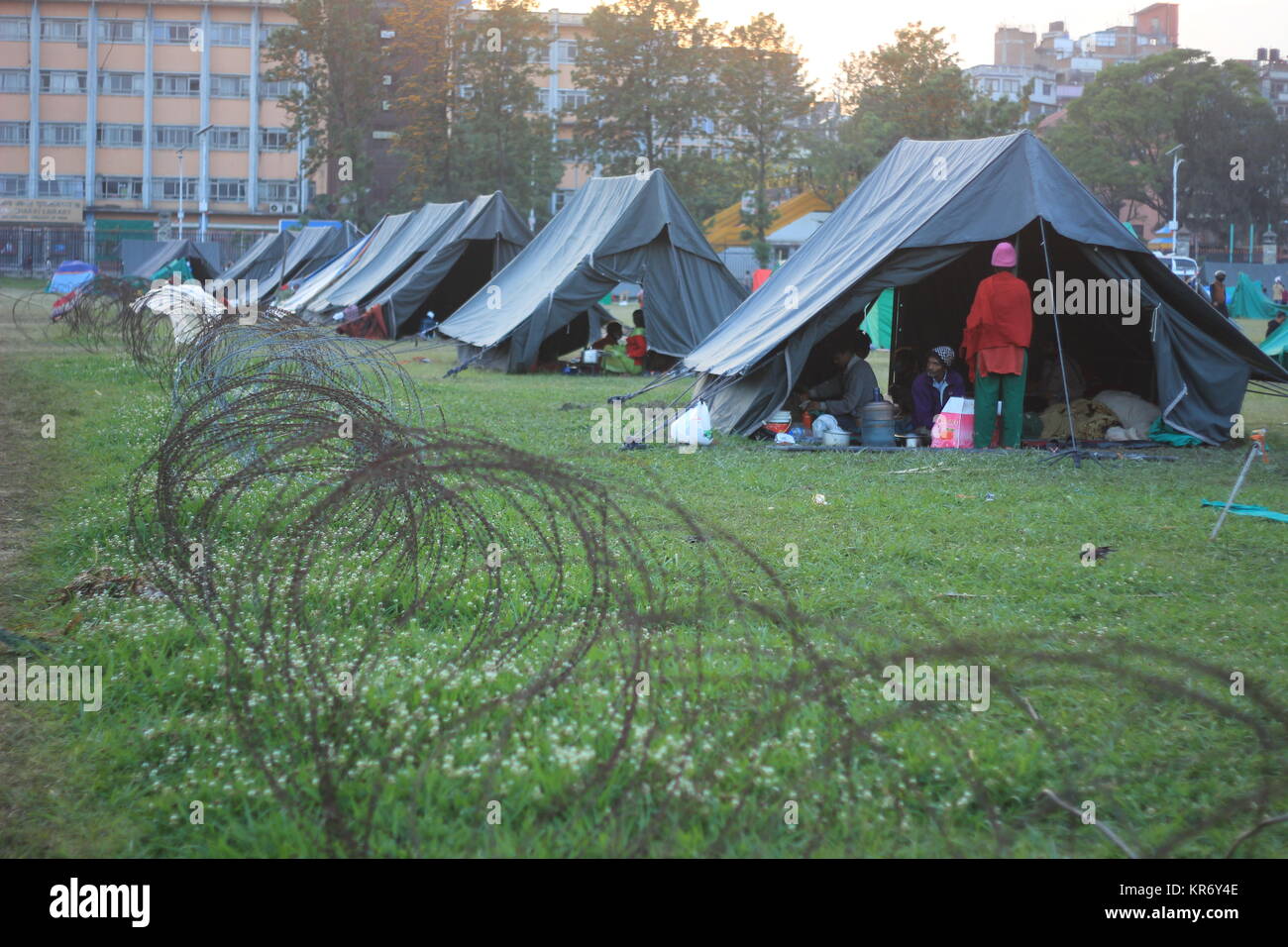 Thousands of families have been sleeping outside in makeshift camps in 2015 Earthquake in Nepal. Stock Photo