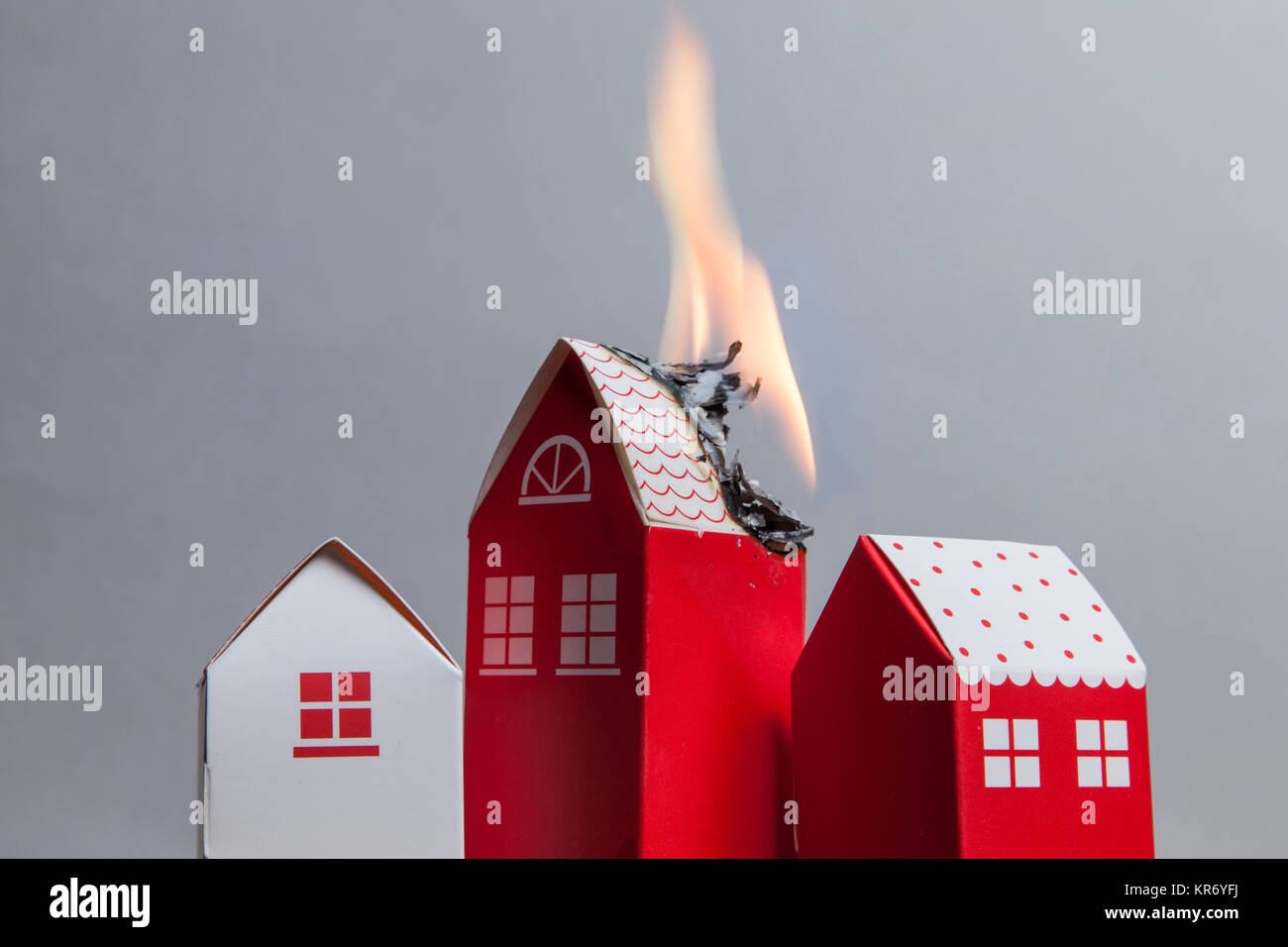 House fire concept. Toy house with flames Stock Photo Alamy