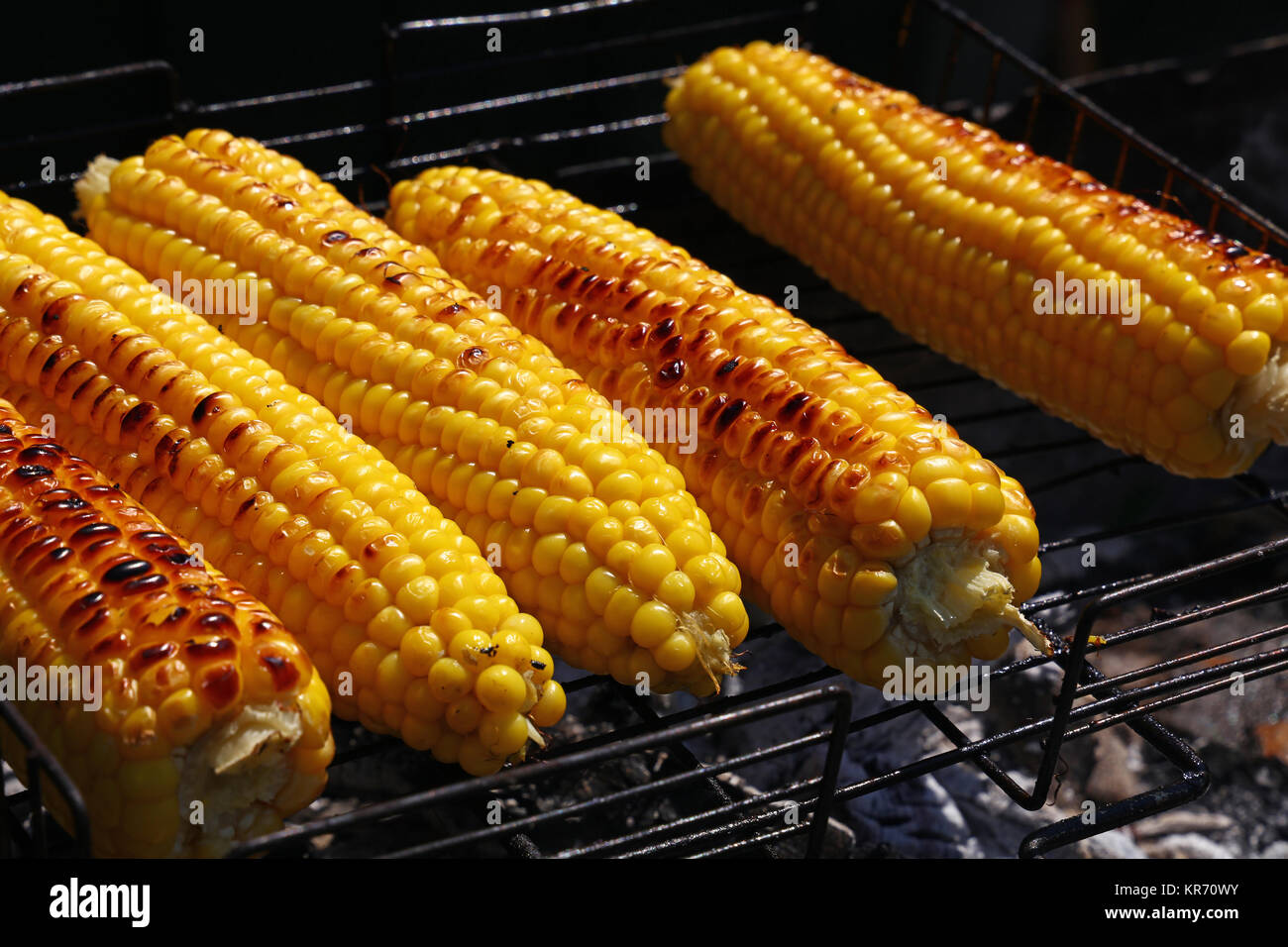 Cooked corn cobs on barbecue grill Stock Photo Alamy