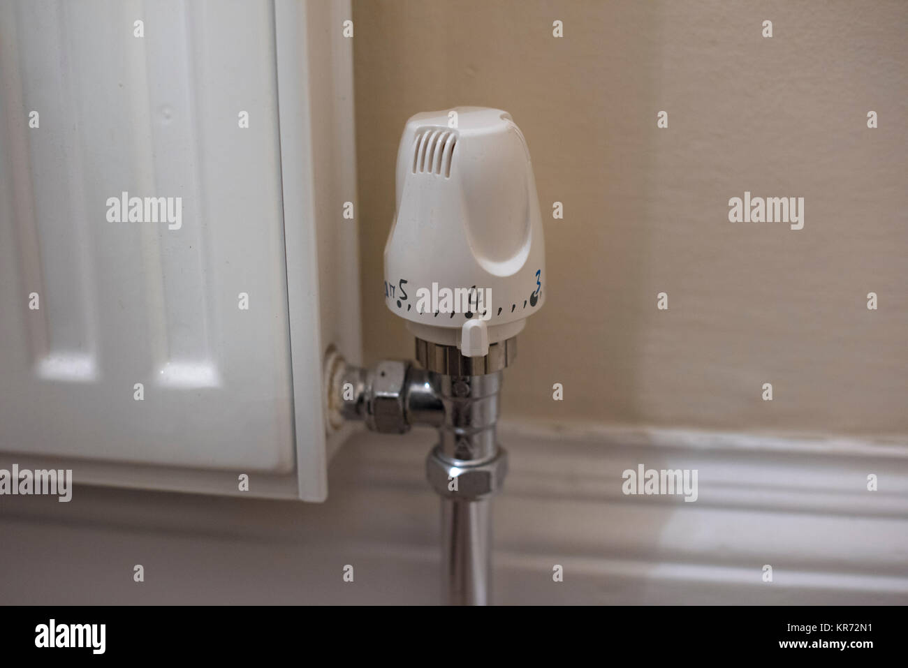Heater temperature setting knob set at value 4. Stock Photo