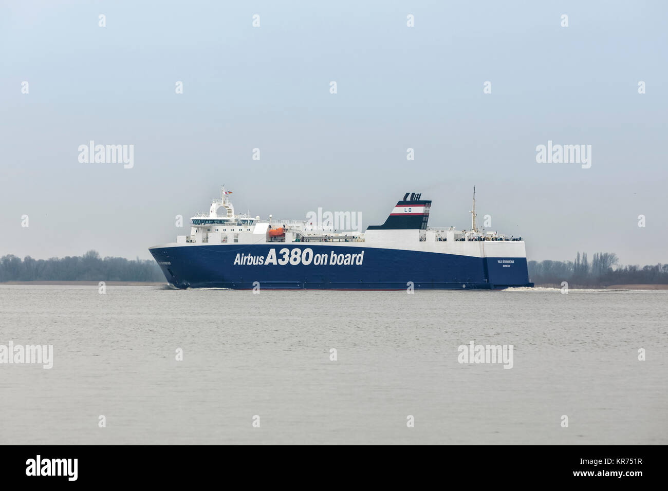 Hollern, Germany - December 15, 2015: Ro-ro cargo ship VILLE DE BORDEAUX on Elbe river transporting Airbus airplane parts to Montoir, France. The vess Stock Photo