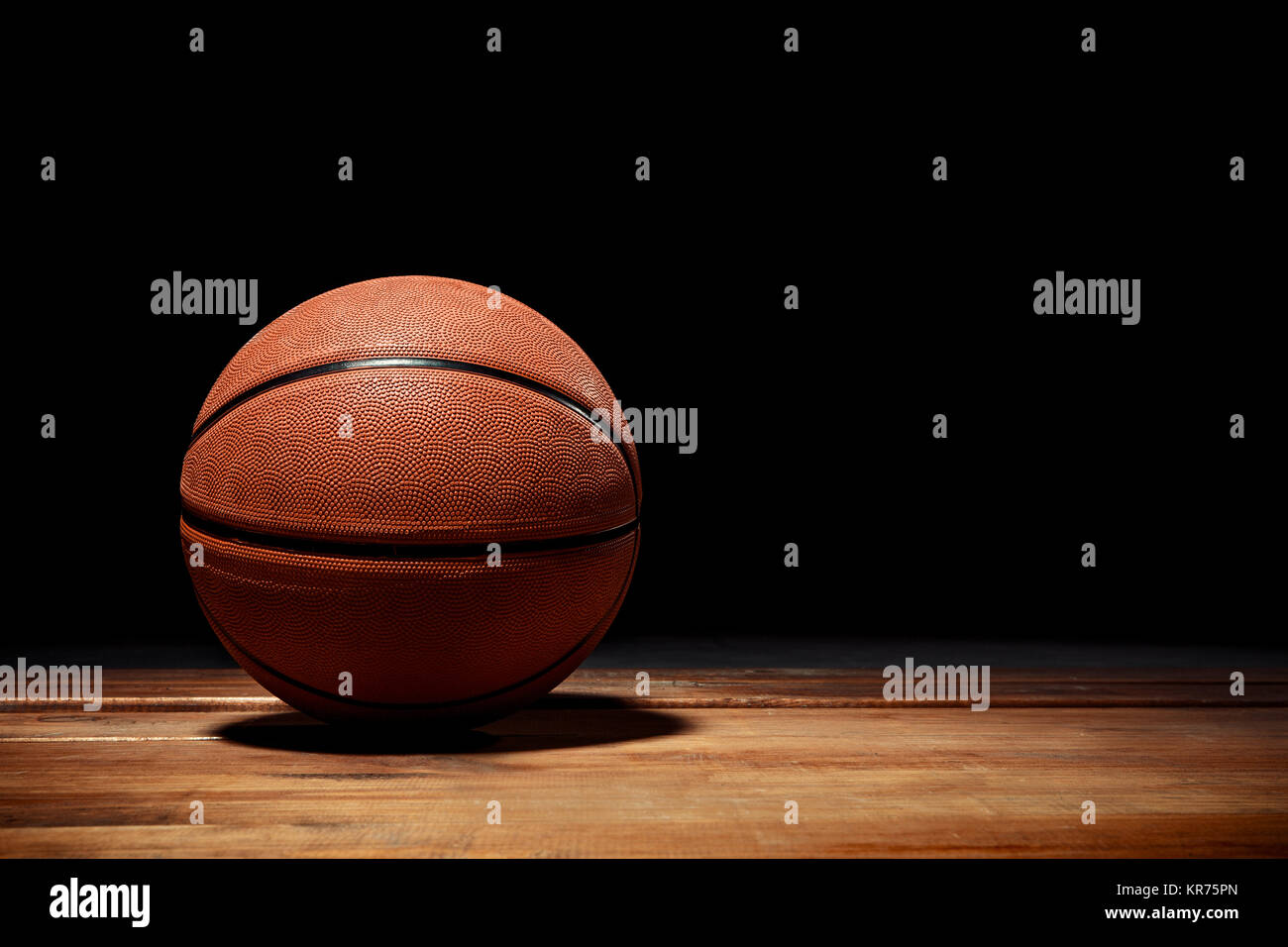 Basketball on a hardwood court floor Stock Photo Alamy