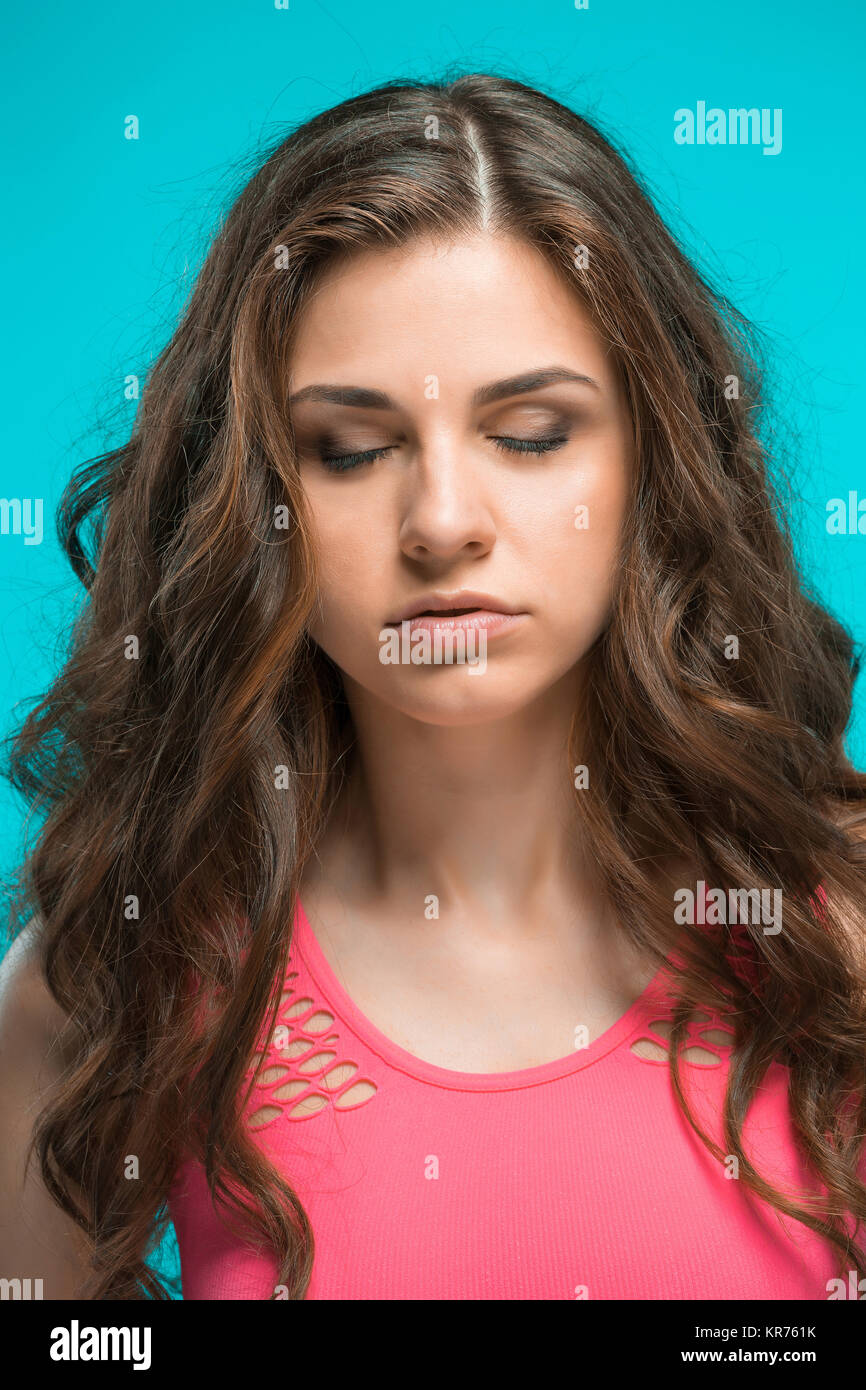 The young woman's portrait with thoughtful emotions Stock Photo - Alamy