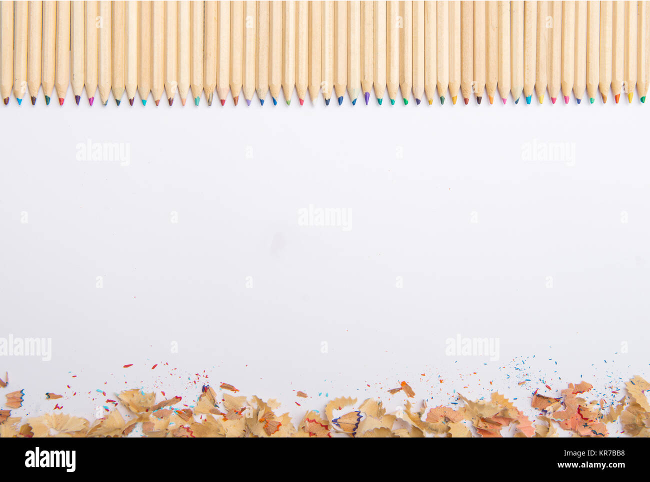 Colorful pencil crayons on white paper Stock Photo Alamy