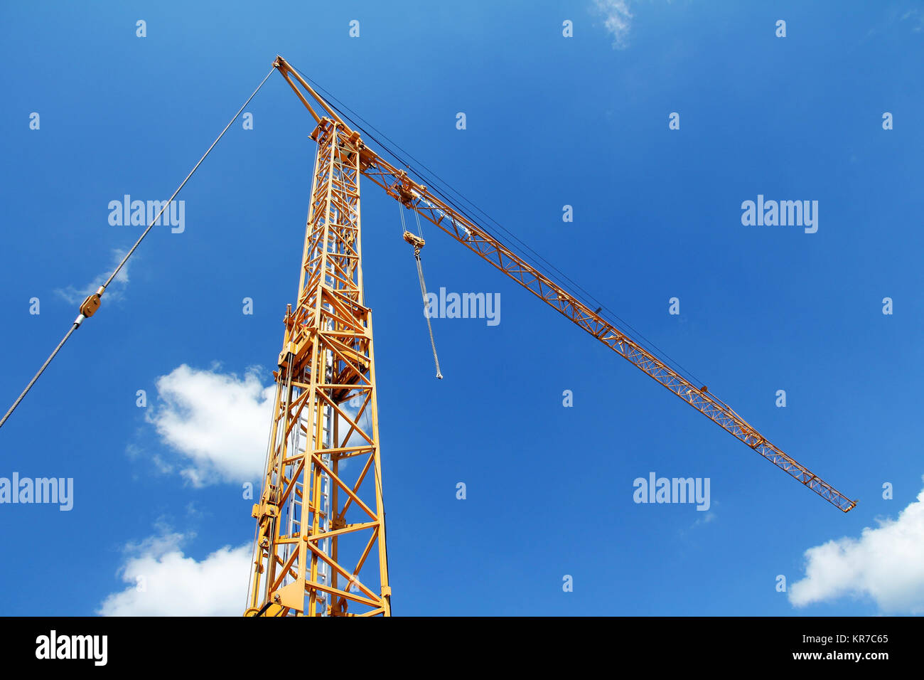 a yellow crane against the blue sky Stock Photo