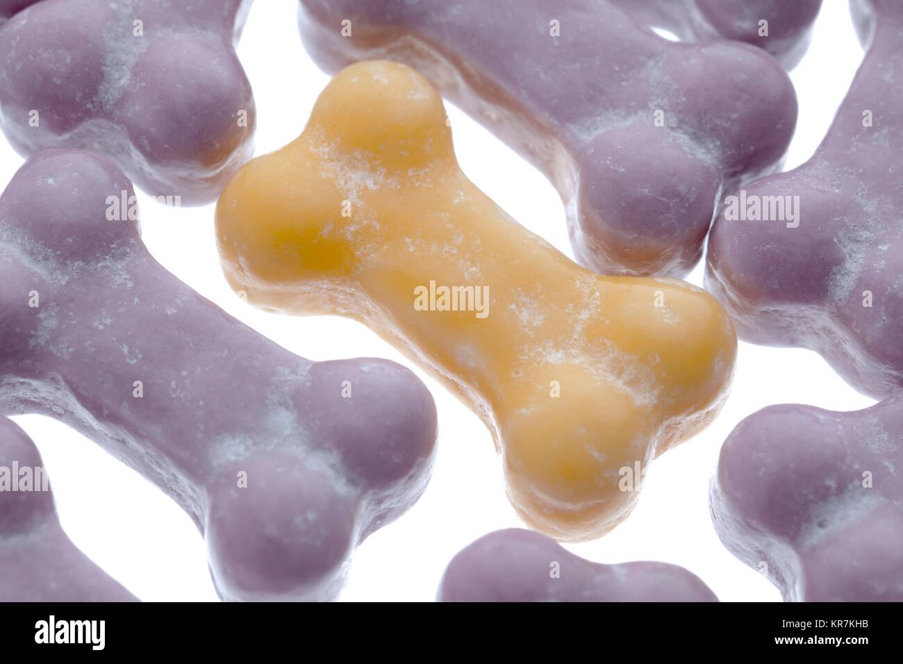 violet and yellow mini dog bone candies Stock Photo Alamy