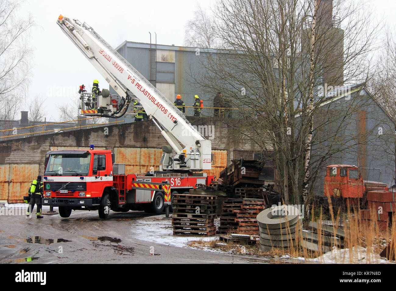 SALO, FINLAND - FEBRUARY 16, 2013: Firefightes extinguish the first Salo Cement Plant fire, but the second fire on the same day destroys the old facto Stock Photo