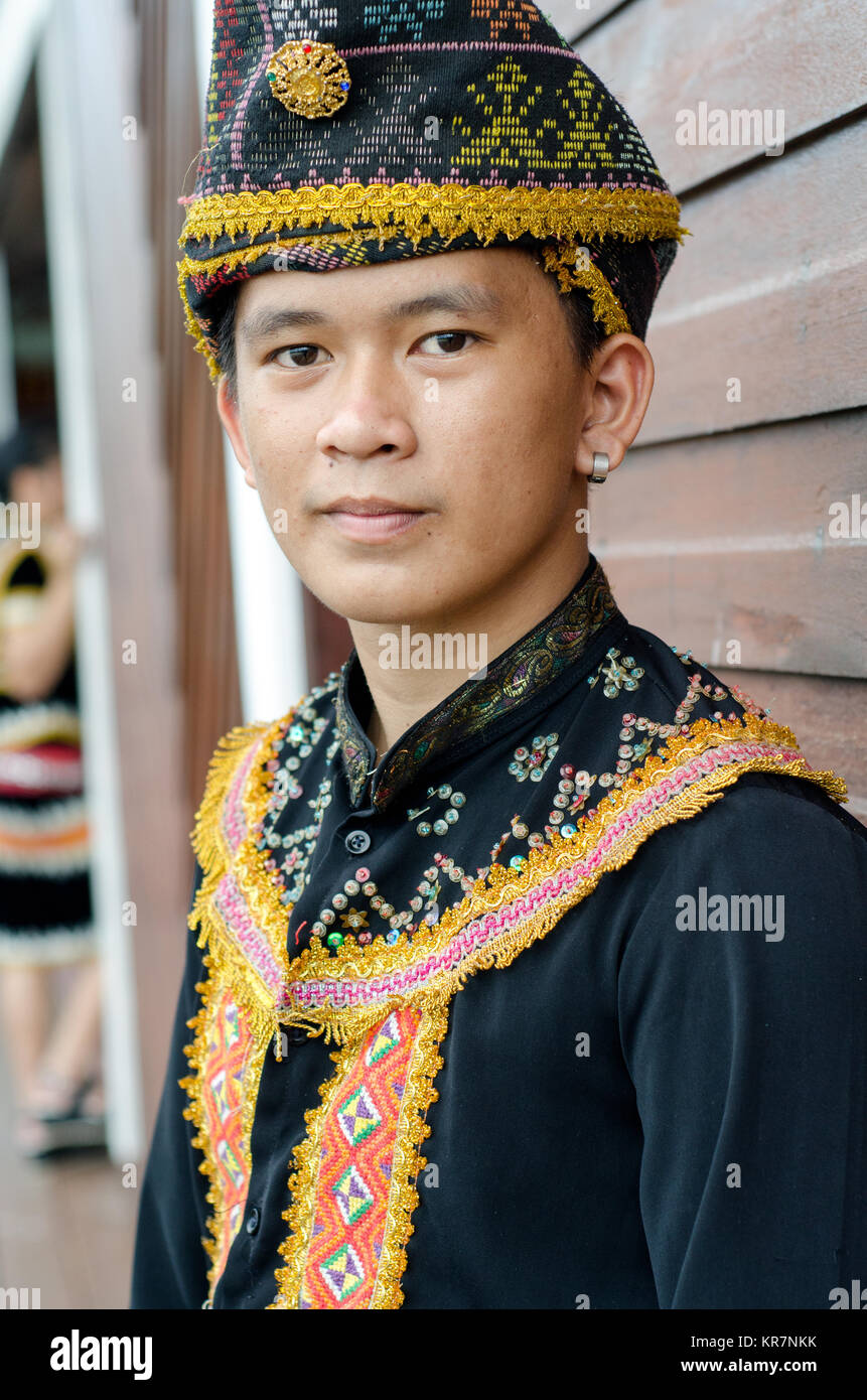 Young Man From Indigenous Dusun Lotud people of Sabah Borneo in East Malaysia in traditional attire during Musical and Dance Festival. Stock Photo