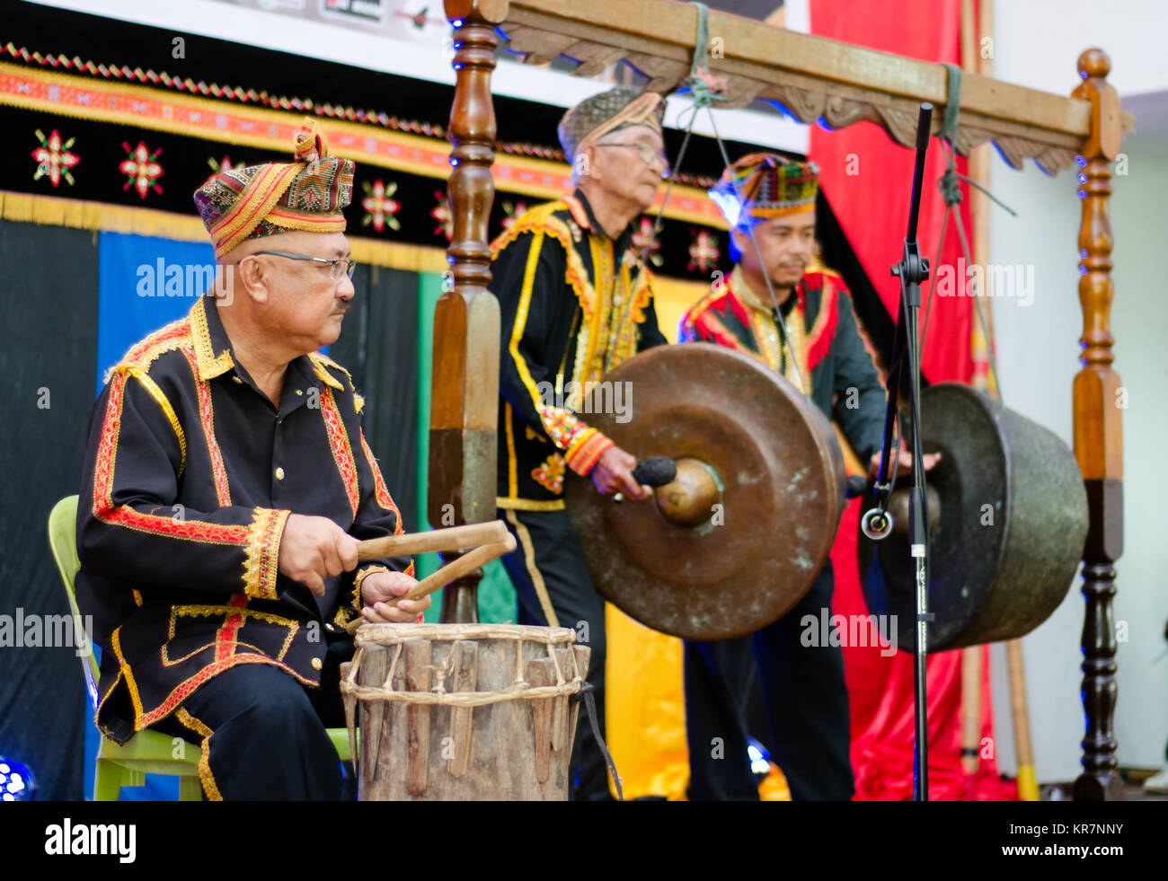 Tuaran Kota Kinabalu, Malaysia - December 02, 2017: Indegenous people of Sabah Borneo in East Malaysia playing a gong a traditional music instrument d Stock Photo