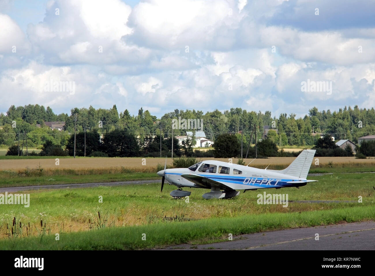 FORSSA, FINLAND - AUGUST 11, 2013: Moving Piper Archer 2 aeroplane ready to take off.  Piper Archer 2 is a light aircraft designed for flight training Stock Photo
