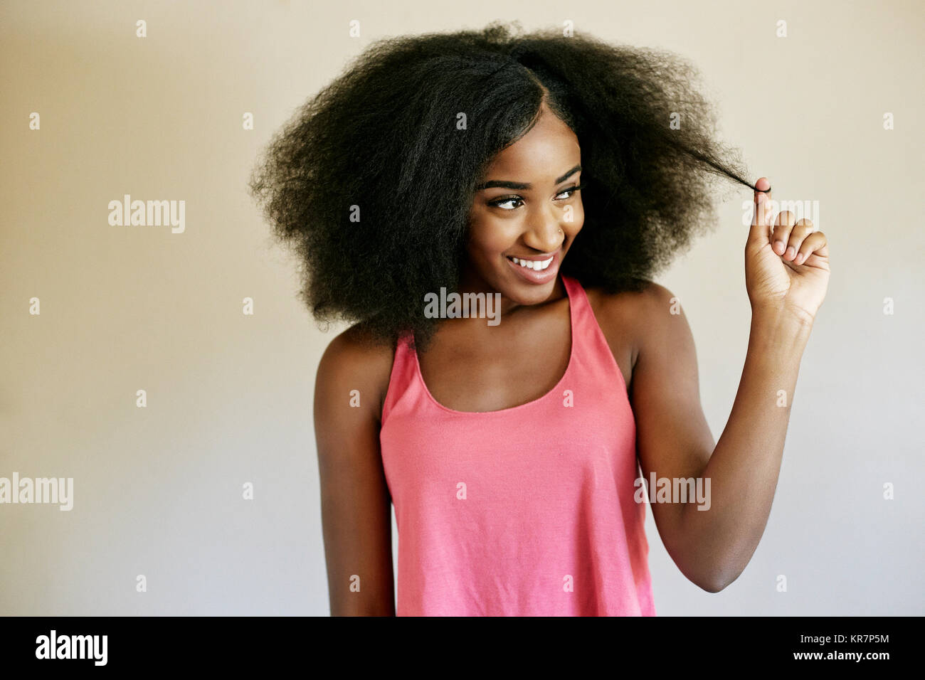 Mixed race woman pulling hair Stock Photo