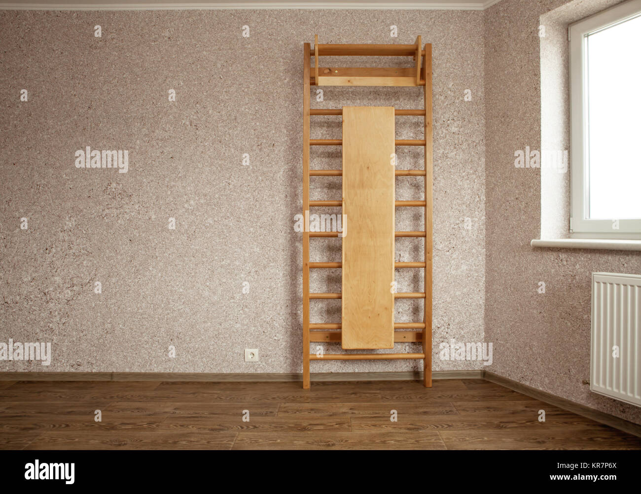 empty room for gymnastics with wall mounted gym ladder Stock Photo Alamy