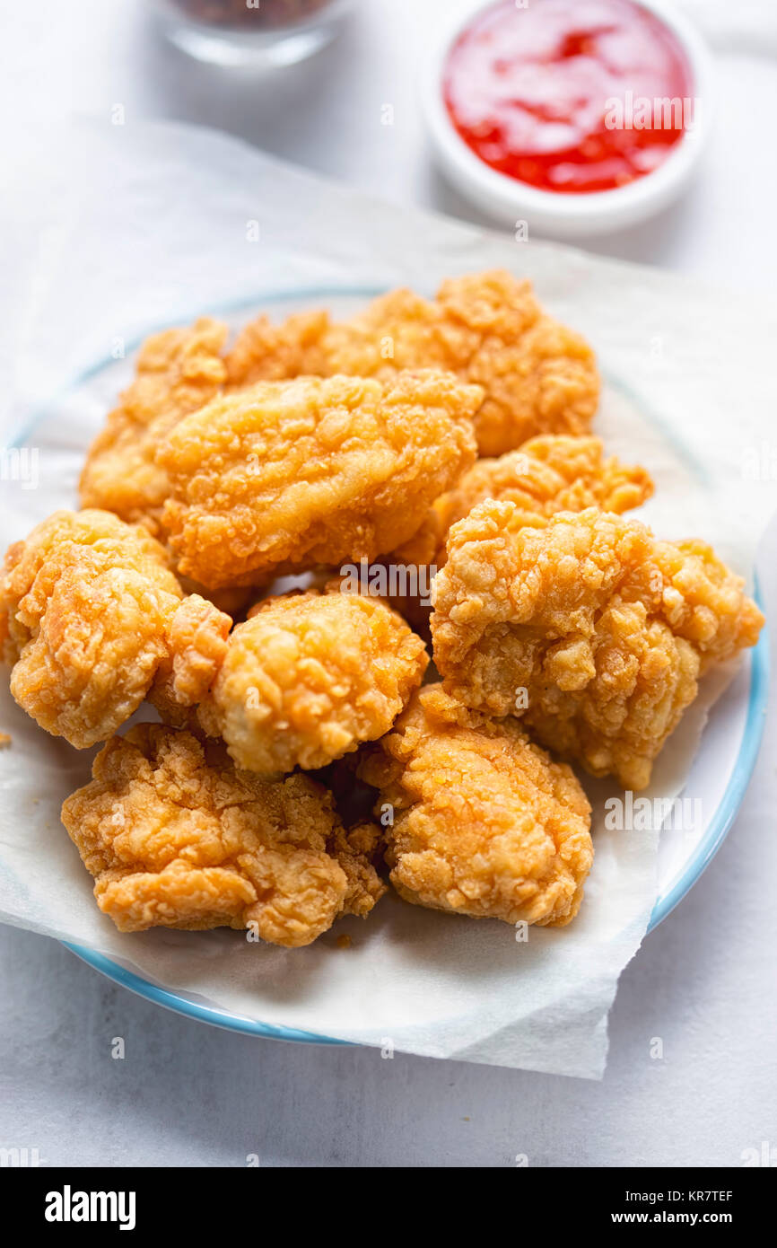 Chicken chunks with batter, sweet chilli dip Stock Photo Alamy