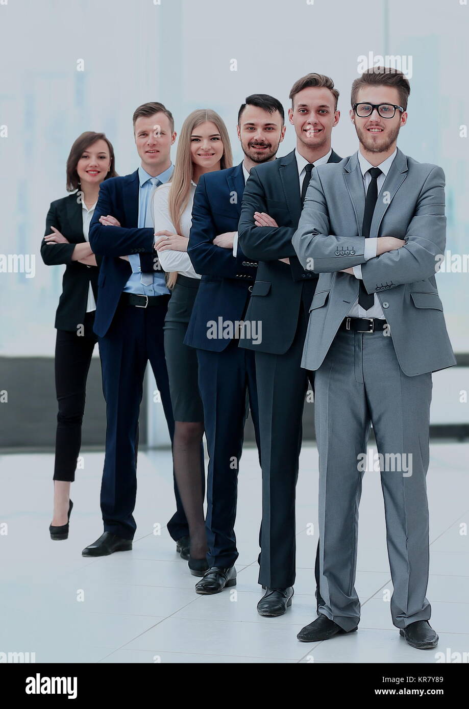 Happy smiling business team in office Stock Photo - Alamy
