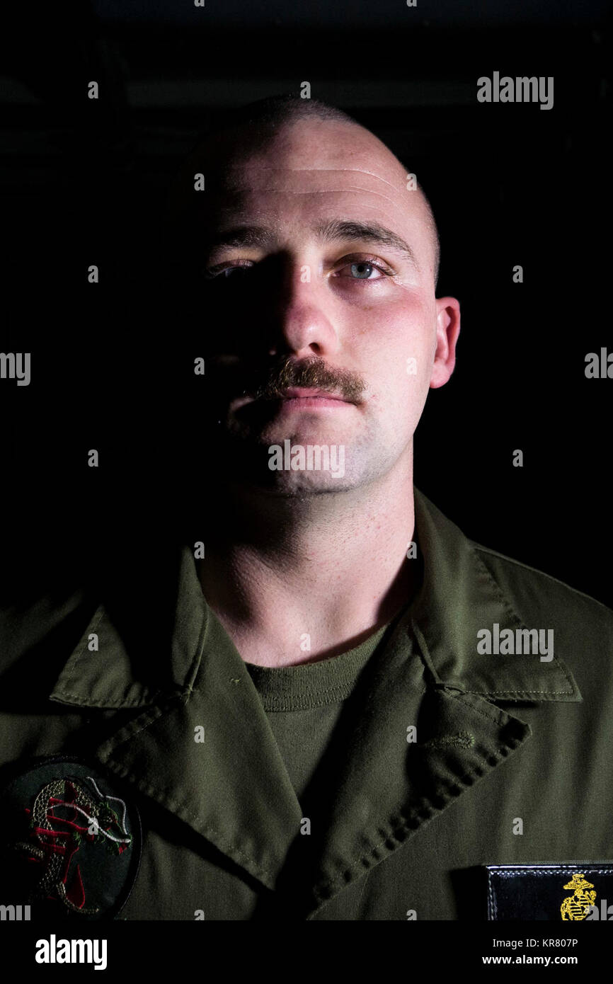 Cpl. Augustus Harlow, from Artesia, New Mexico and assigned to Marine Medium Tiltrotor Squadron (VMM) 265 (Reinforced), poses for a portrait on the amphibious transport dock USS Green Bay (LPD 20) during Talisman Saber 2017. Green Bay, part of a combined U.S. -Australia-New Zealand expeditionary strike group, is undergoing a series of scenarios that will increase naval proficiencies in operating against blue-water adversarial threats and in its primary mission of launching Marine forces ashore in the littorals. Talisman Saber is a biennial U.S. -Australia bilateral exercise held off the coast  Stock Photo