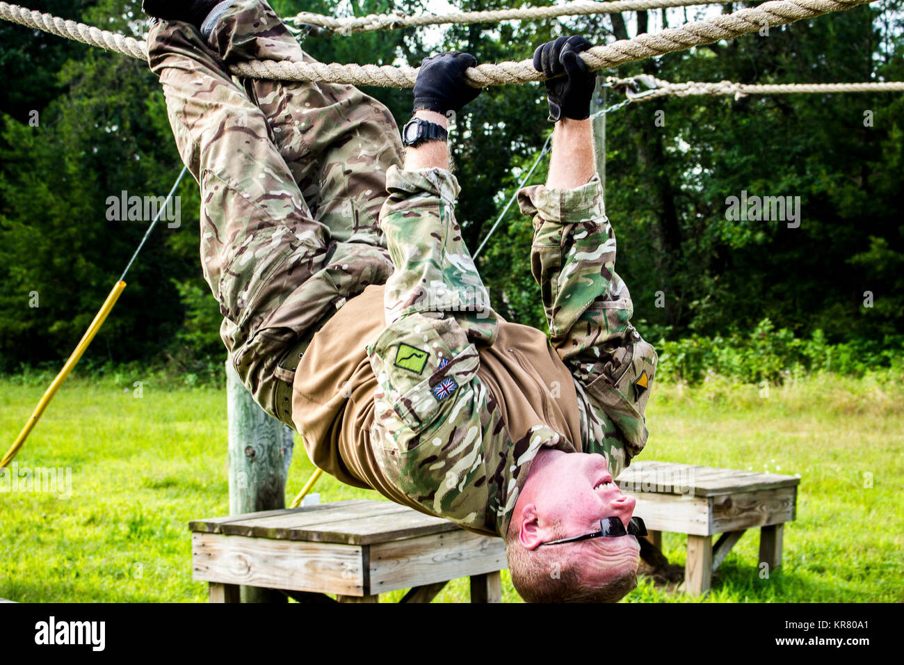 Cpl. Mark Pope completes a rope crawl in the conditioning course July 31  during annual training at Ft. McCoy, Wis. Pope, a member of the United  Kingdom's 156th Regiment, Royal Logistic Corps,