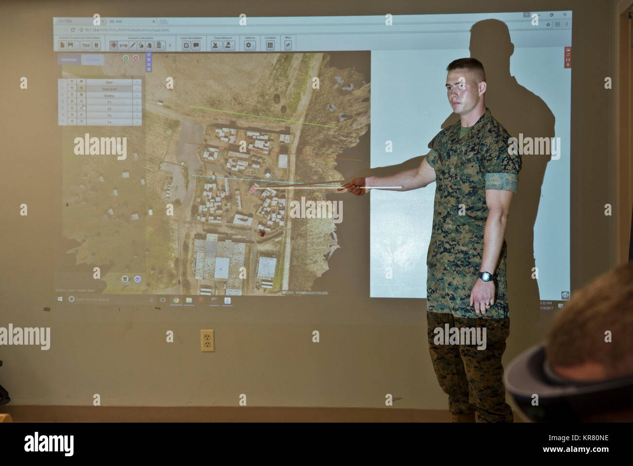 U.S. Marine Corps Lance Cpl. Caleb Hamrick, infantry rifleman, 3rd Marine Regiment, speaks to the Assistant Commandant of the Marine Corps, Gen. Glenn M. Walters, about the Tactical Decision Kit (TDK) on Marine Corps Base Hawaii, Hawaii, Nov. 3, 2017. TDK is a virtual decision kit that enhances a rifleman's ability to use tactical, decisive thinking in any environment. (U.S. Marine Corps Stock Photo