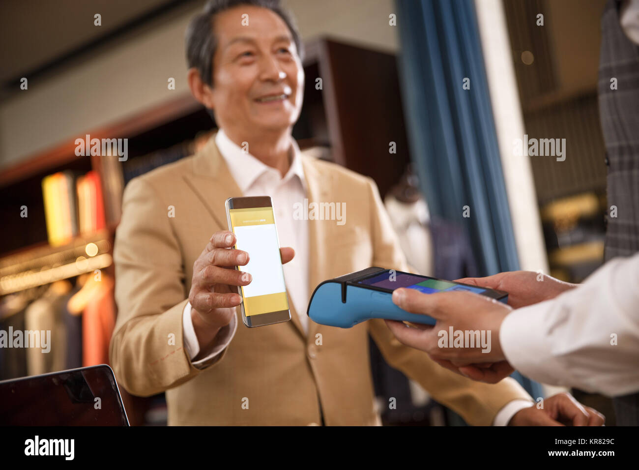 Fashion designers and customers at the checkout counter Stock Photo Alamy