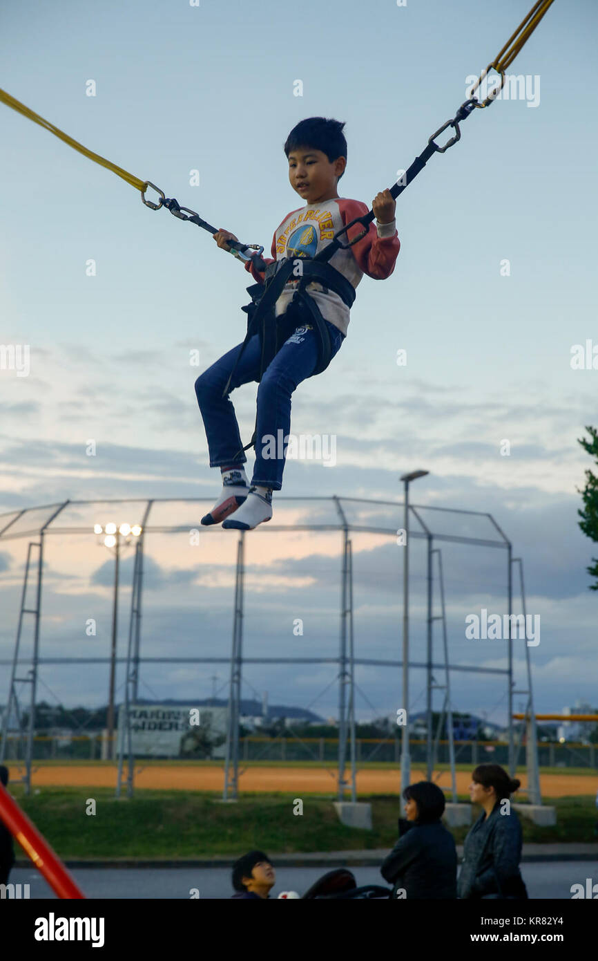 CAMP COURTNEY, OKINAWA, Japan A child bounces on a trampoline during