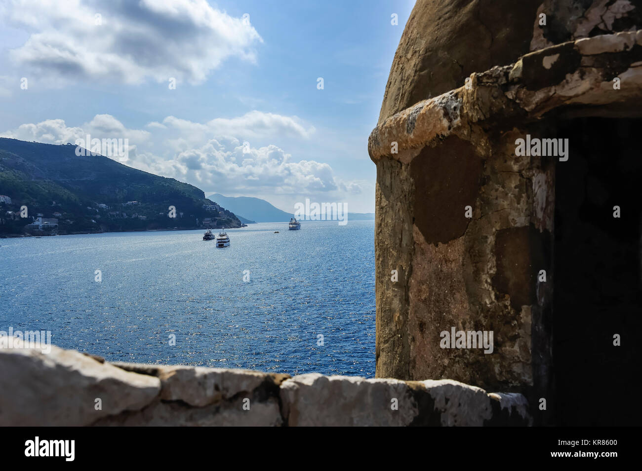 fortress of dubrovnik overlooking the ships off the coast Stock Photo