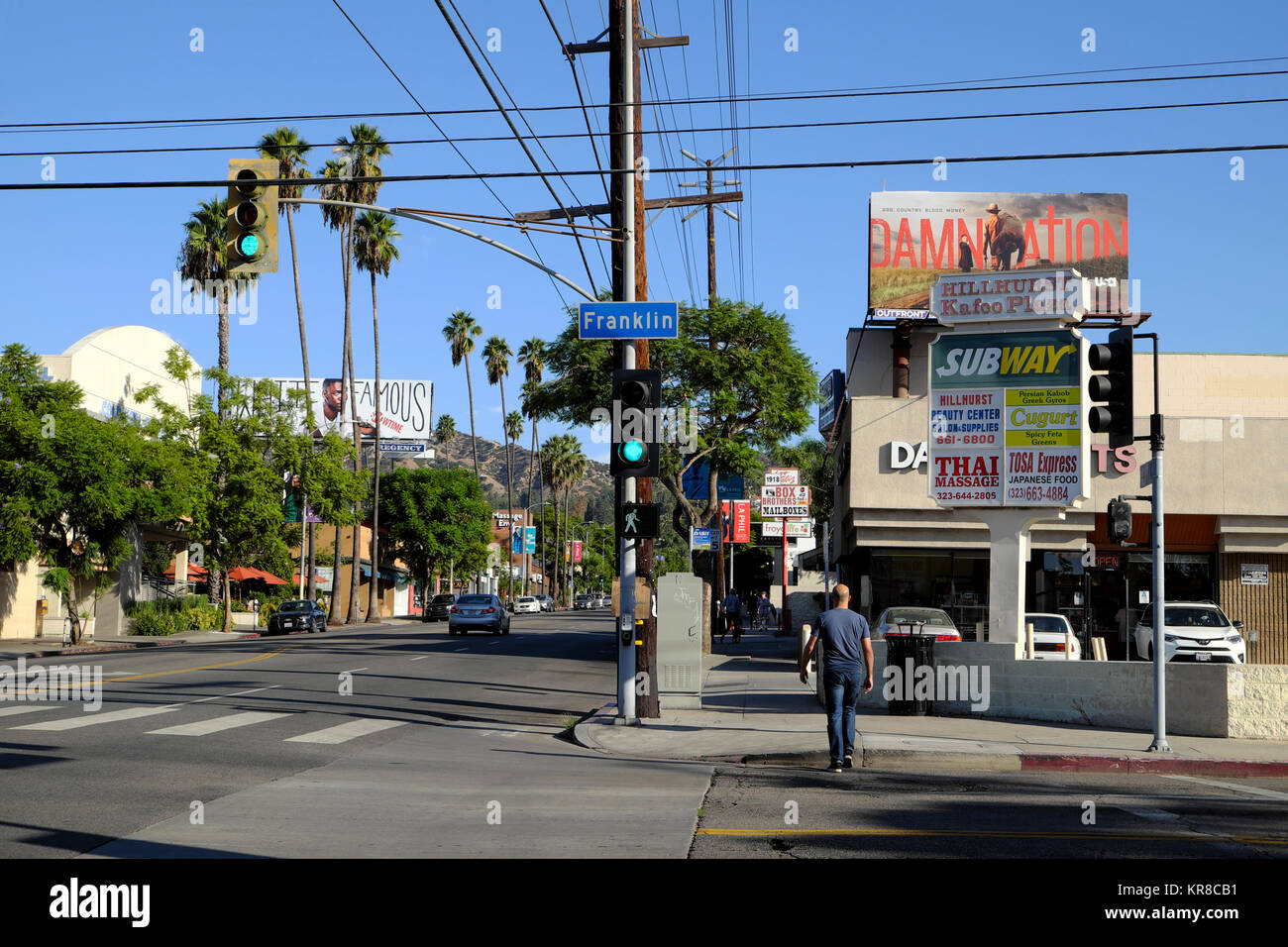 Traffic lights at Hillhurst Ave and Franklin Avenue looking north in