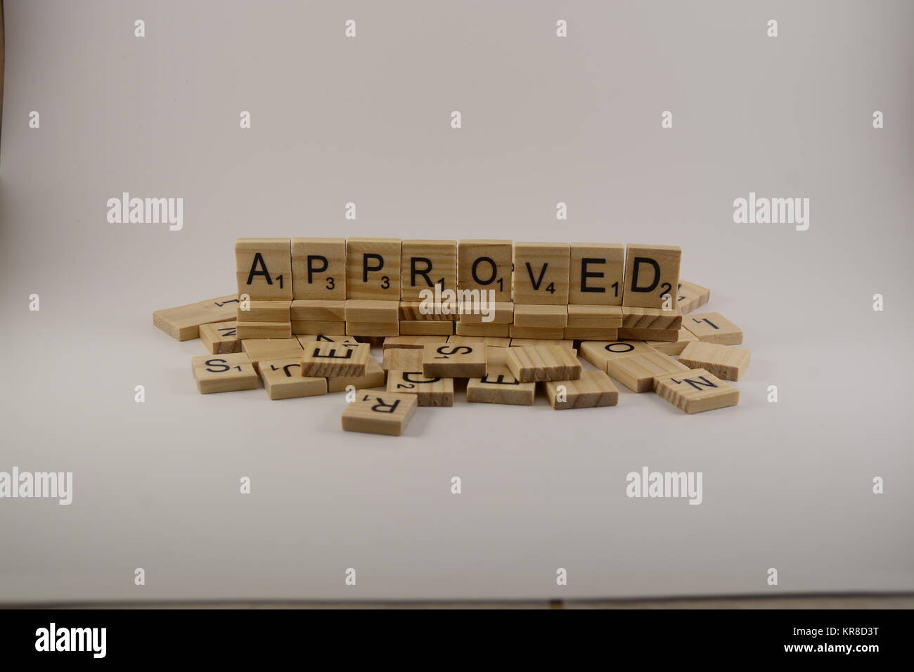 word Approved written in scrabble tiles Stock Photo Alamy