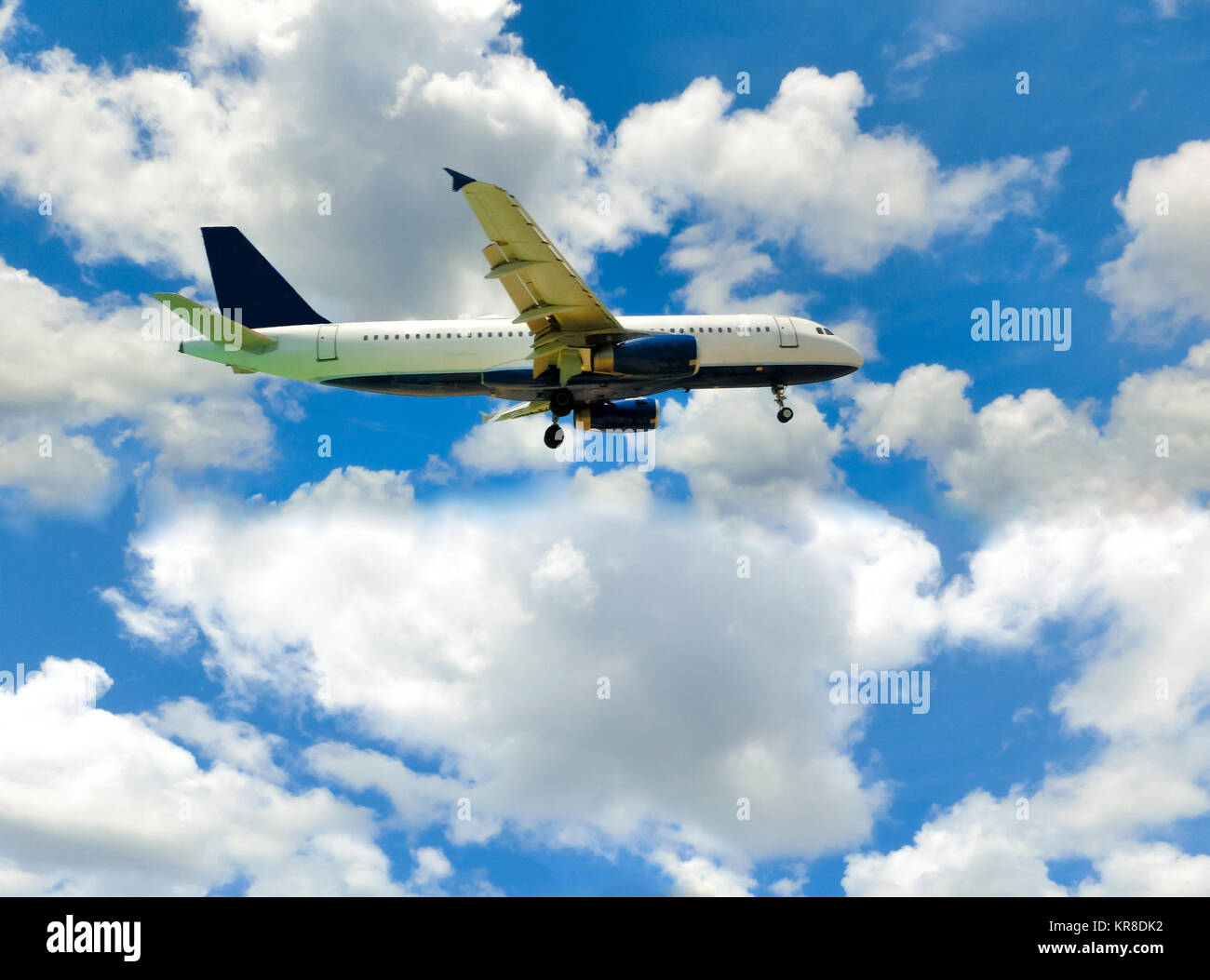 The airplane in the blue sky Stock Photo - Alamy