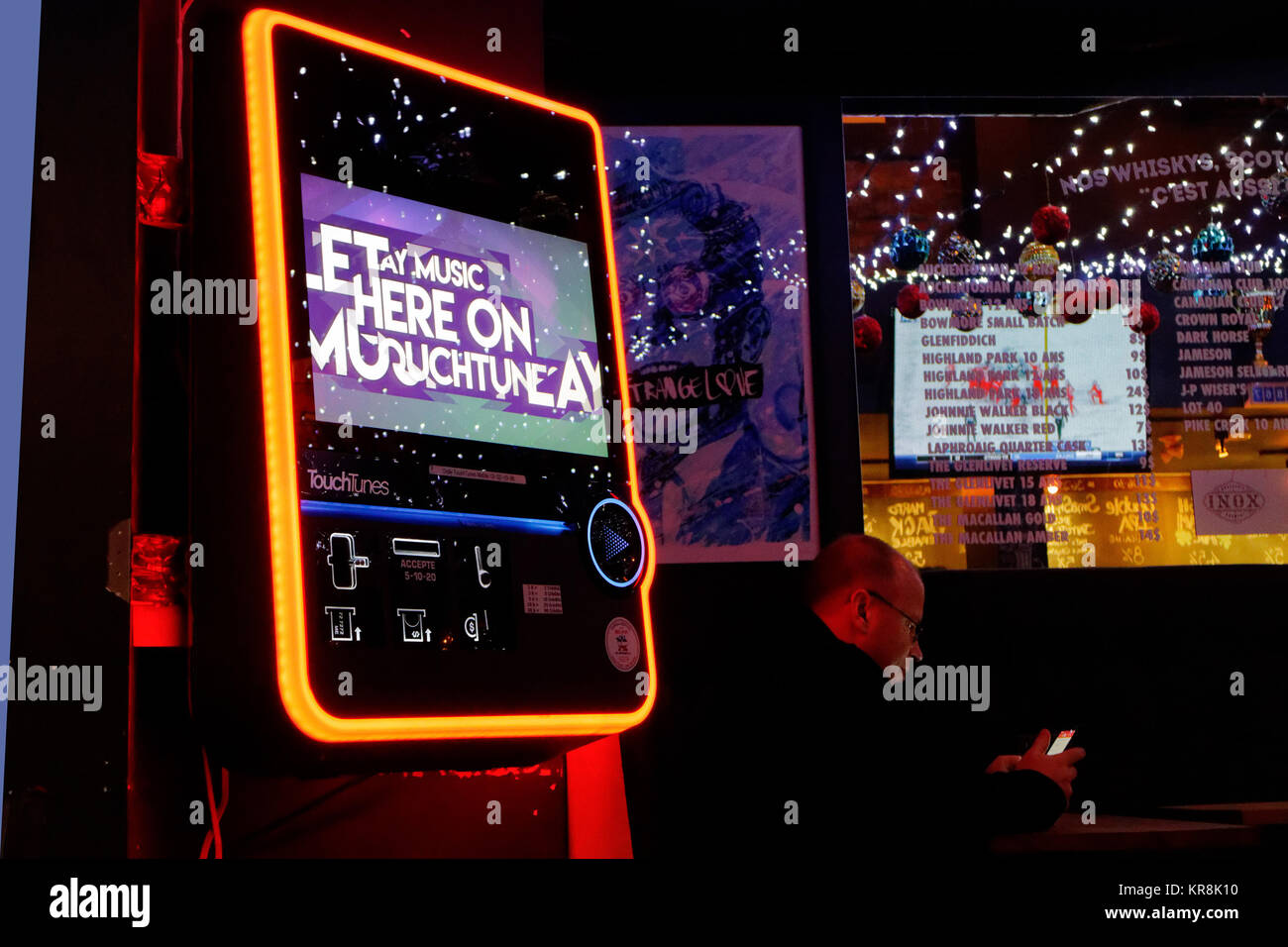A digital jukebox that looks like a cell phone in a abar in Quebec CIty Stock Photo