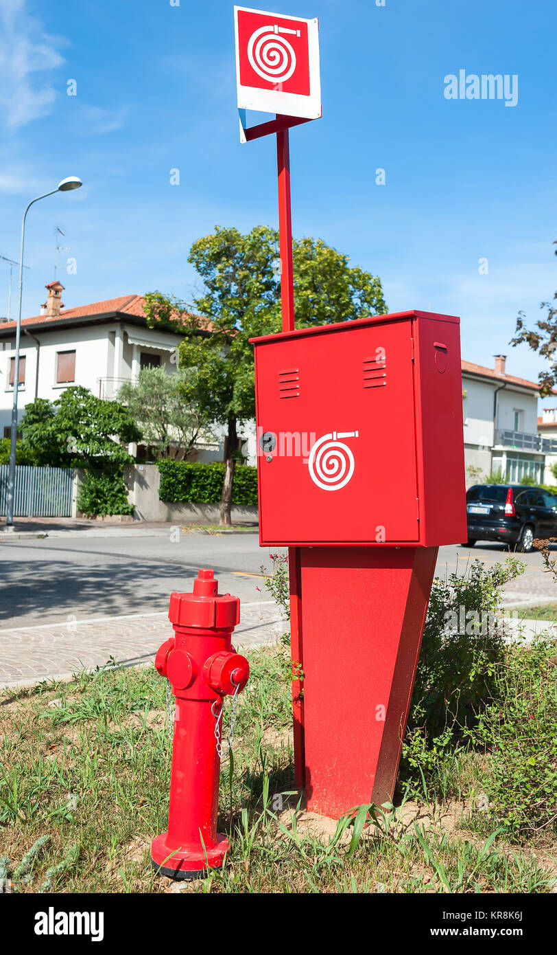 Fire hydrant and container for the fire hose hi-res stock