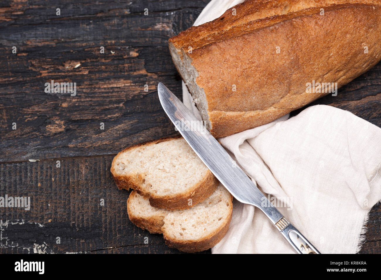 Rustic bread on wood table. Dark woody background with free text space ...