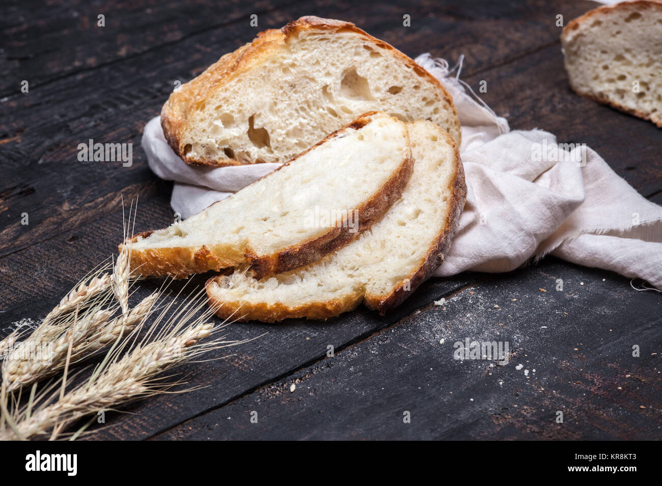 Rustic bread on wood table. Dark moody background with free text space ...