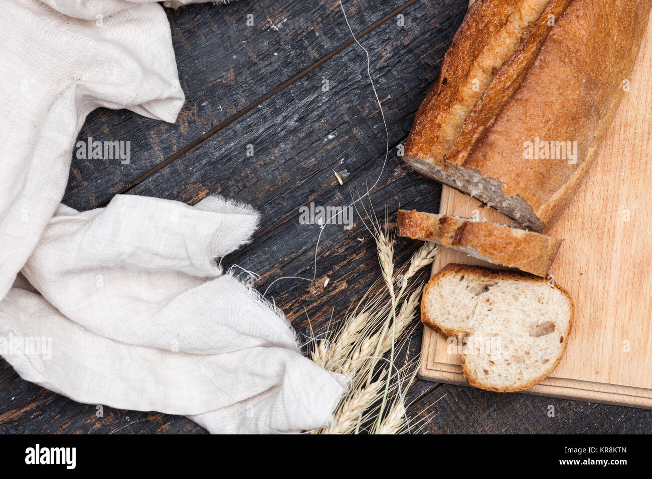 Rustic bread on wood table. Dark woody background with free text space ...