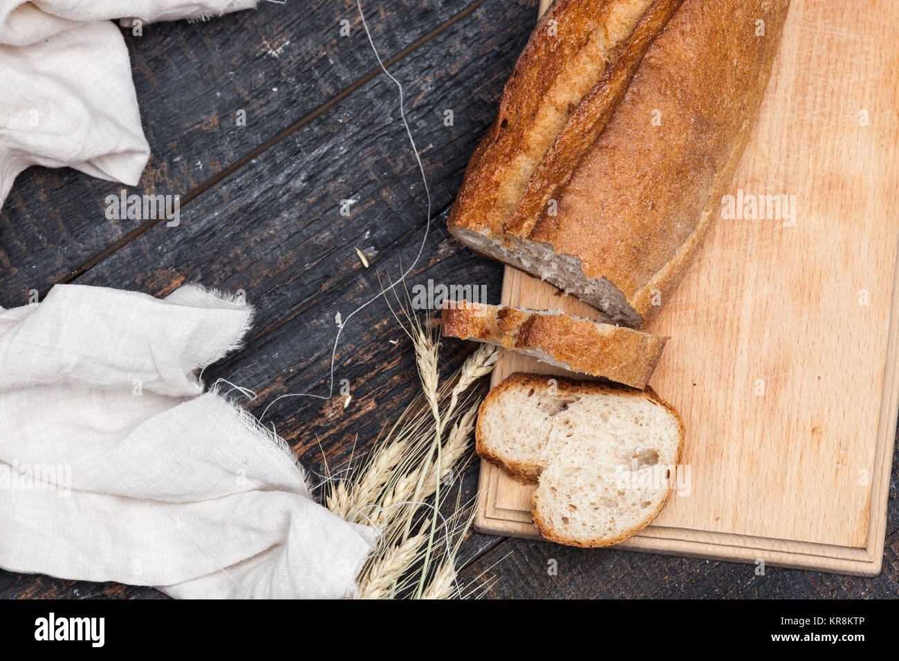 Rustic bread on wood table. Dark woody background with free text space ...