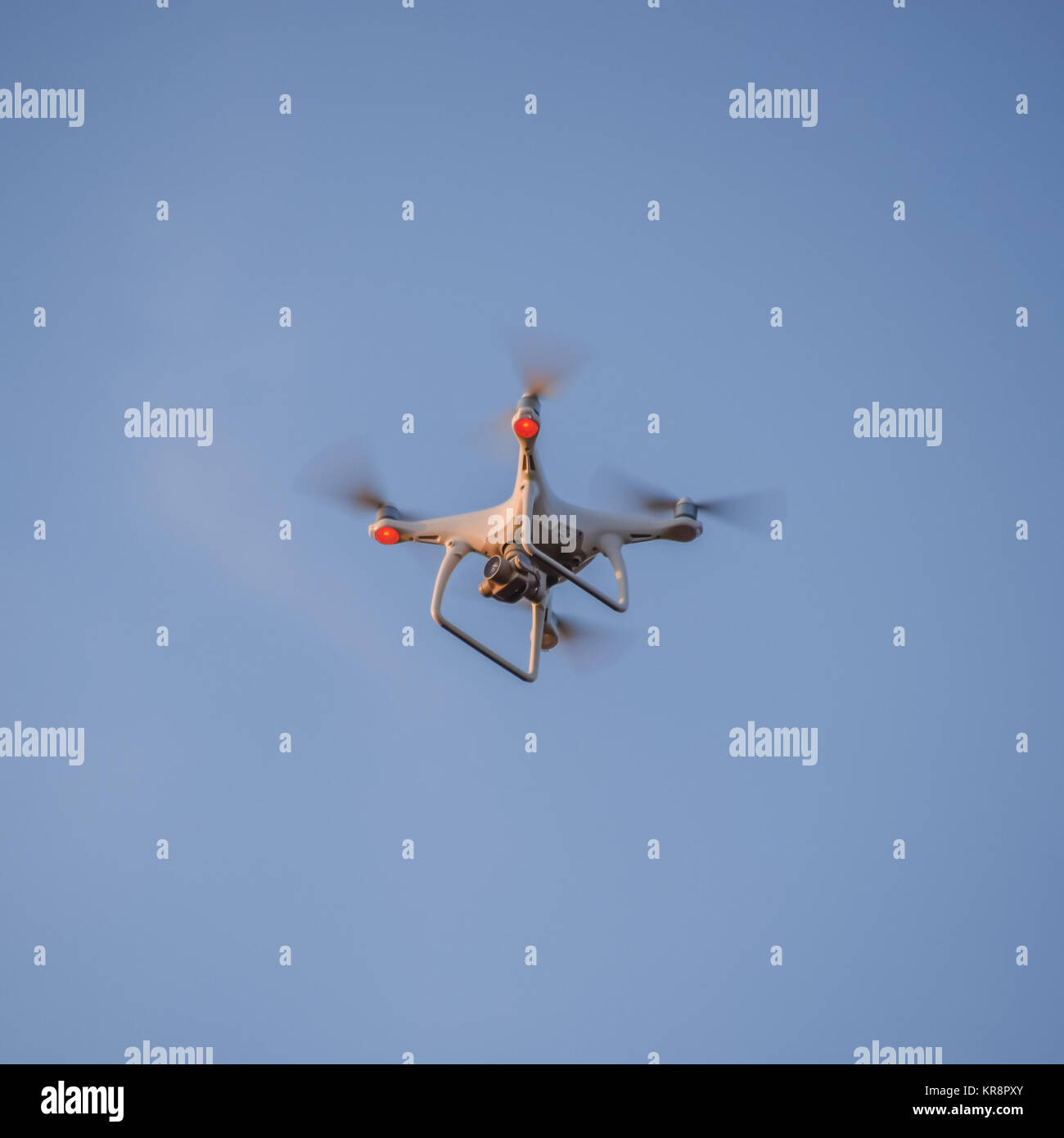 The drone, hovering in the sky. Flight quadrocopters Stock Photo Alamy