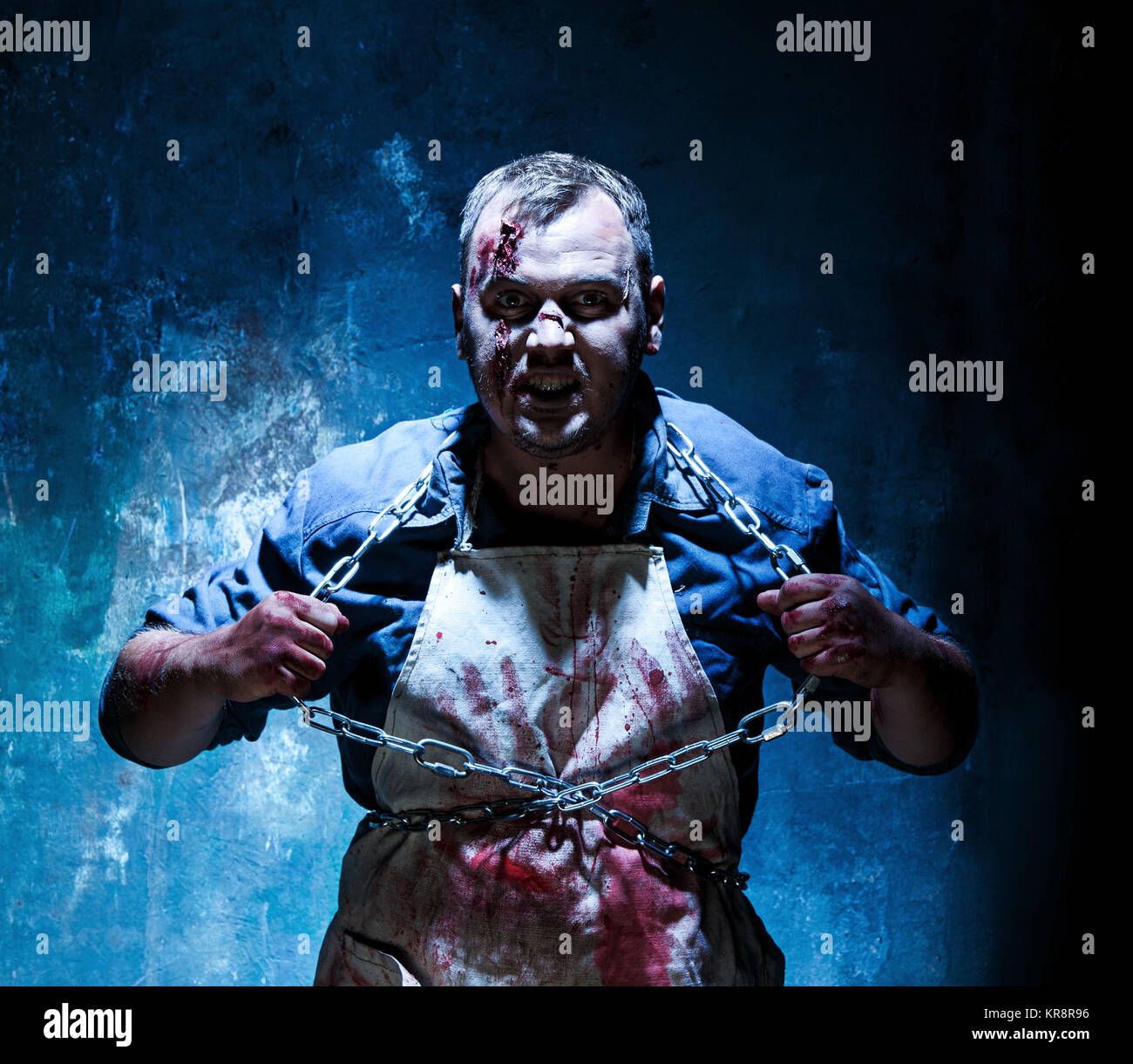 Bloody Halloween theme: crazy killer as butcher Stock Photo