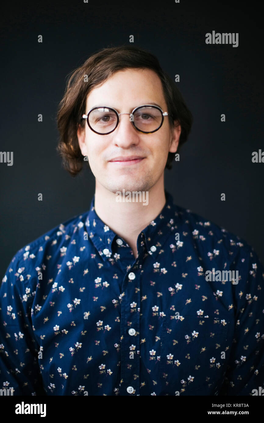 Man in glasses blue shirt hi-res stock photography and images - Alamy