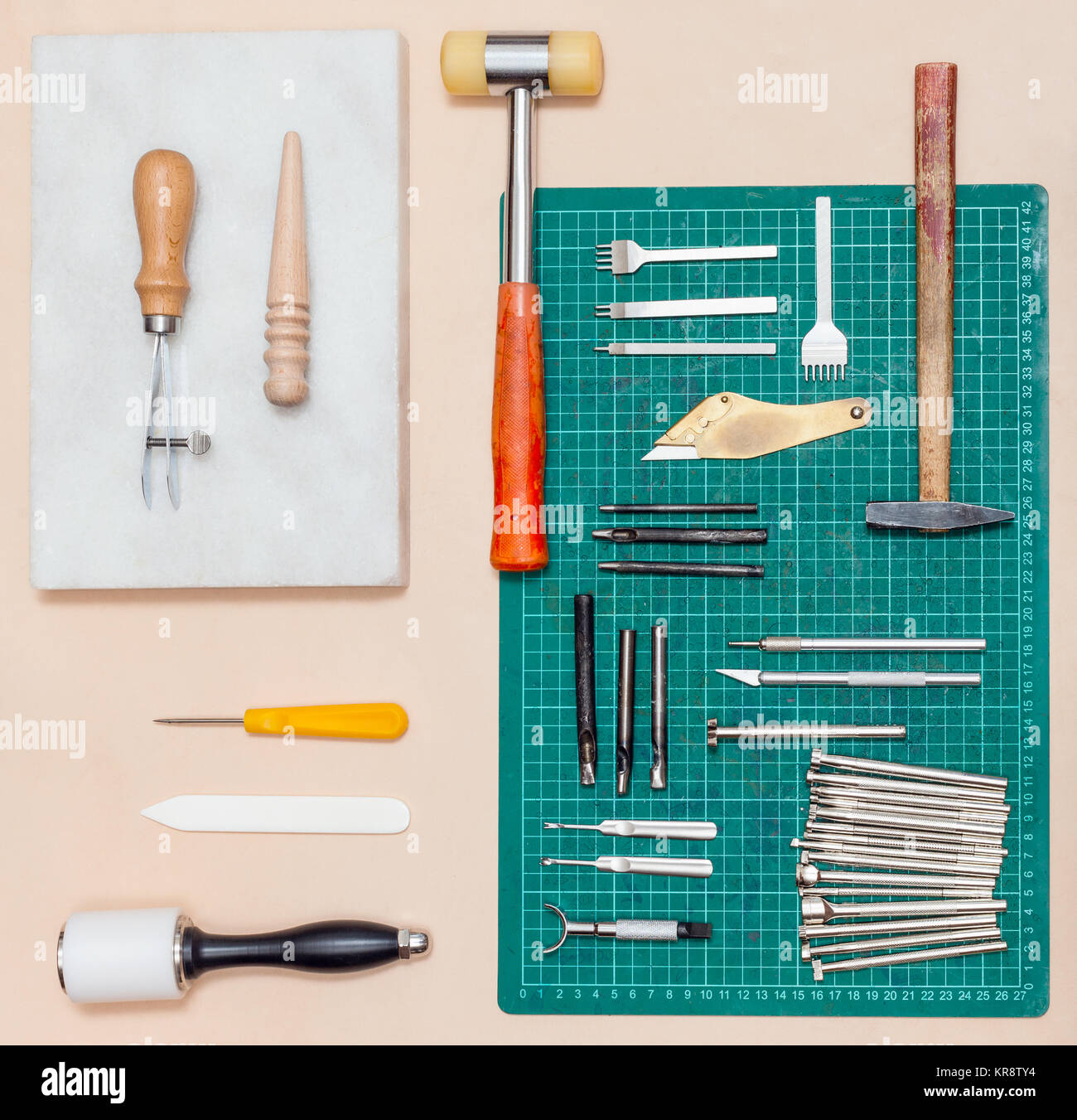 Tanner tools. Handmade Skiving knife and awl Stock Photo - Alamy